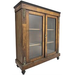 Victorian walnut pier cabinet, moulded rectangular top over inlaid frieze, enclosed by two glazed doors, the uprights with further inlay and ornate floral cast gilt metal mounts, chamfered plinth base on turned feet