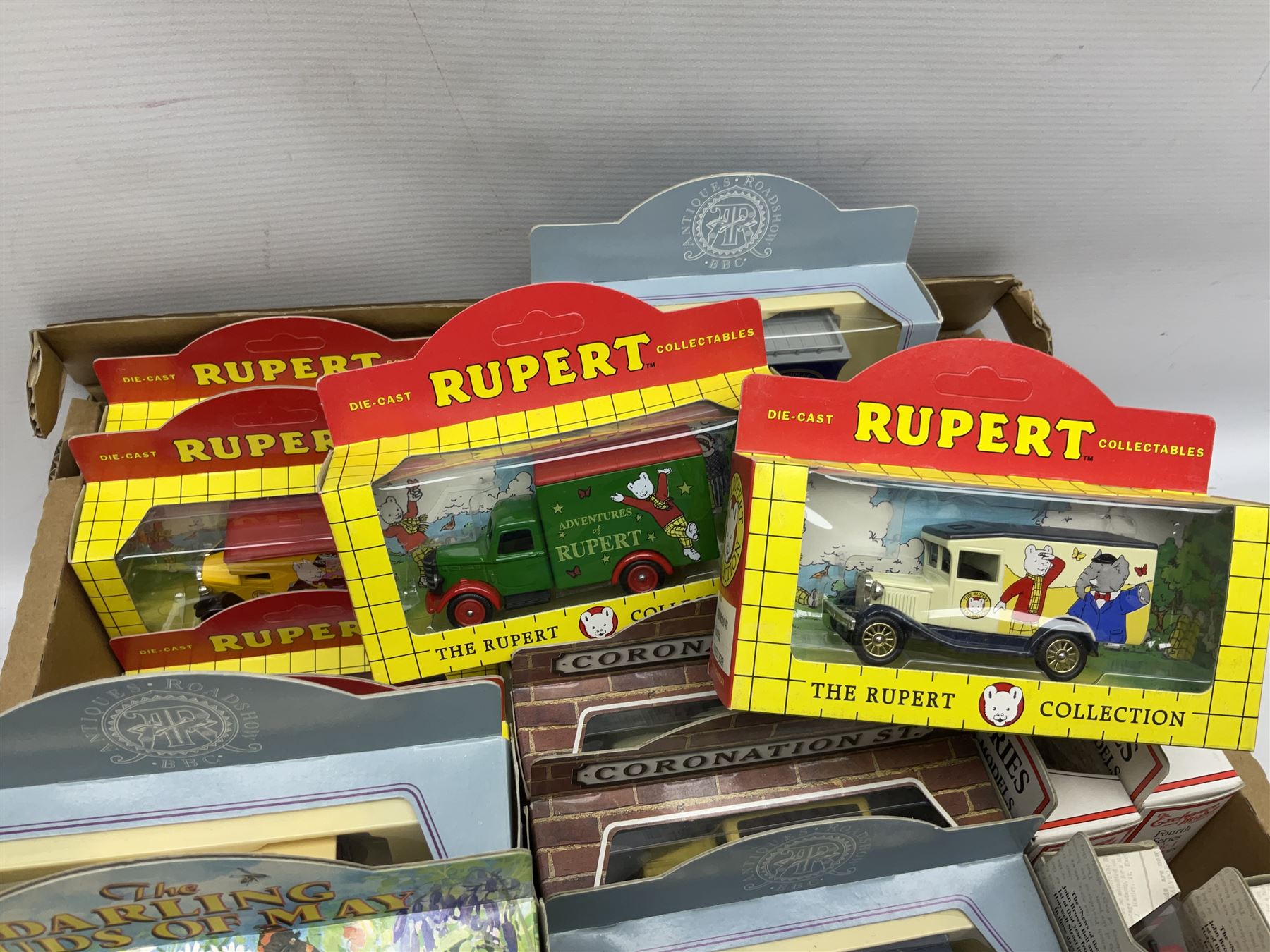 Large collection of Lledo/ Days Gone die-cast models including Antiques Roadshow, Coronation Street, The Darling Birds of May, The Rupert Collection, Heartbeat and others, all boxed (70