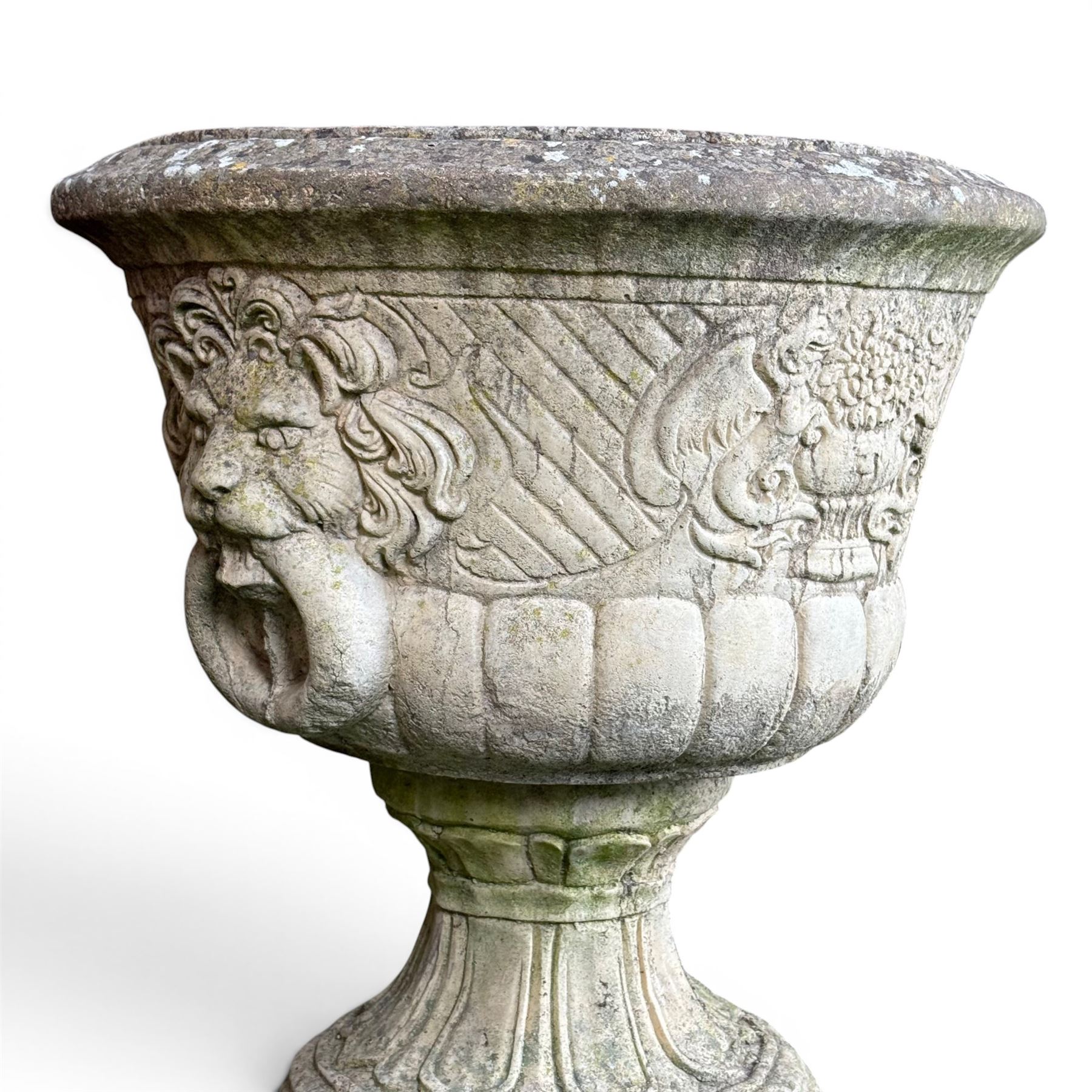 Pair of classic design cast stone garden urns, circular bowl detailed with lion mask loop handles
