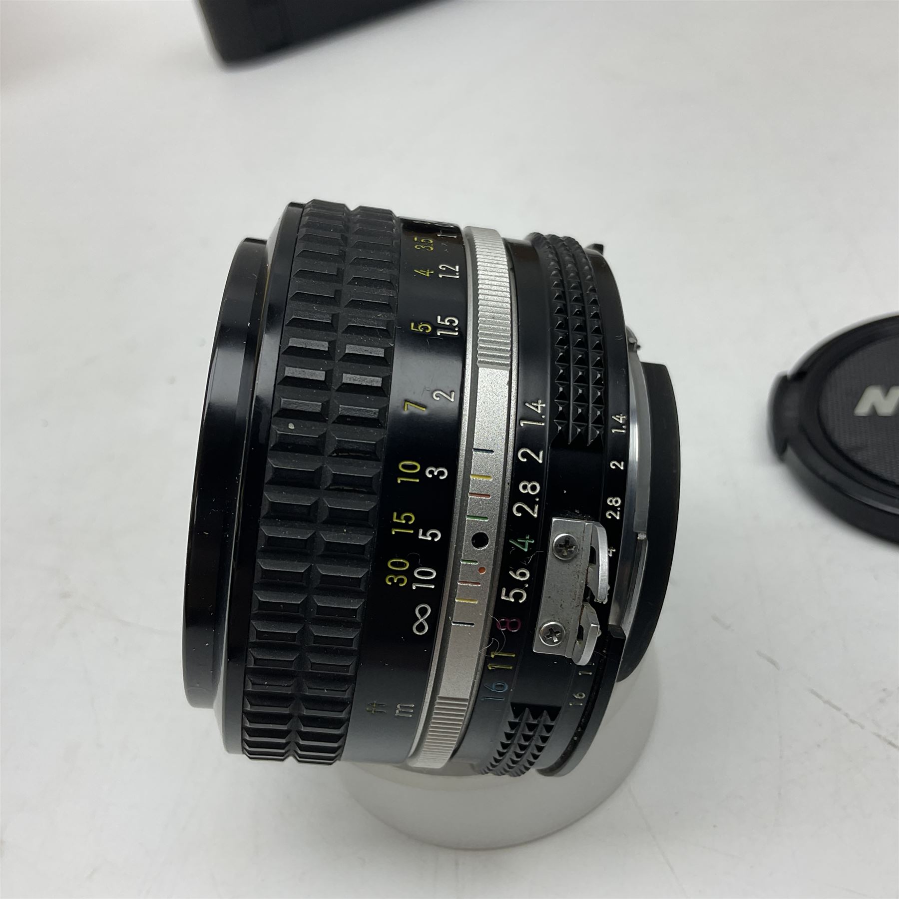 Nikon F3T camera body, in champagne/ titanium colourway, serial no. T8215031, with 'Nikon Nikkor 50mm 1:1.4' lens, Nikon MD4 motor drive, serial no. 156592 and Nikon MK-1 Firing range converter, all with original boxes 