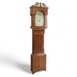 19th century-Oak and Mahogany 8-day longcase clock c 1820 (maker indistinct) with an open carved swan necked pediment and central finial, hood door flanked by turned pilasters, trunk with canted corners and a plain rectangular door, plinth with crossbanding and raised on bracket feet, painted dial with tumbling Arabic's, floral spandrels and conforming decoration to the arch, with a seconds hand, date aperture and brass stamped hands, dial pinned to a rack striking movement striking the hours on a bell. With weights & pendulum.