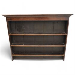 18th century oak plate rack, moulded projecting cornice over three shelves, on solid end supports 