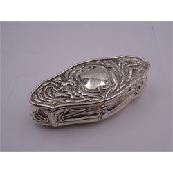 Art nouveau silver dressing table box, of shaped oval form, the sides repousse decorated with interlaced tendrils, the hinged cover with monogramed panel to centre within a foliate surround, hallmarked Birmingham 1906, maker's mark worn and indistinct, L13cm, approximate weight 2.67 ozt (82.9 grams)