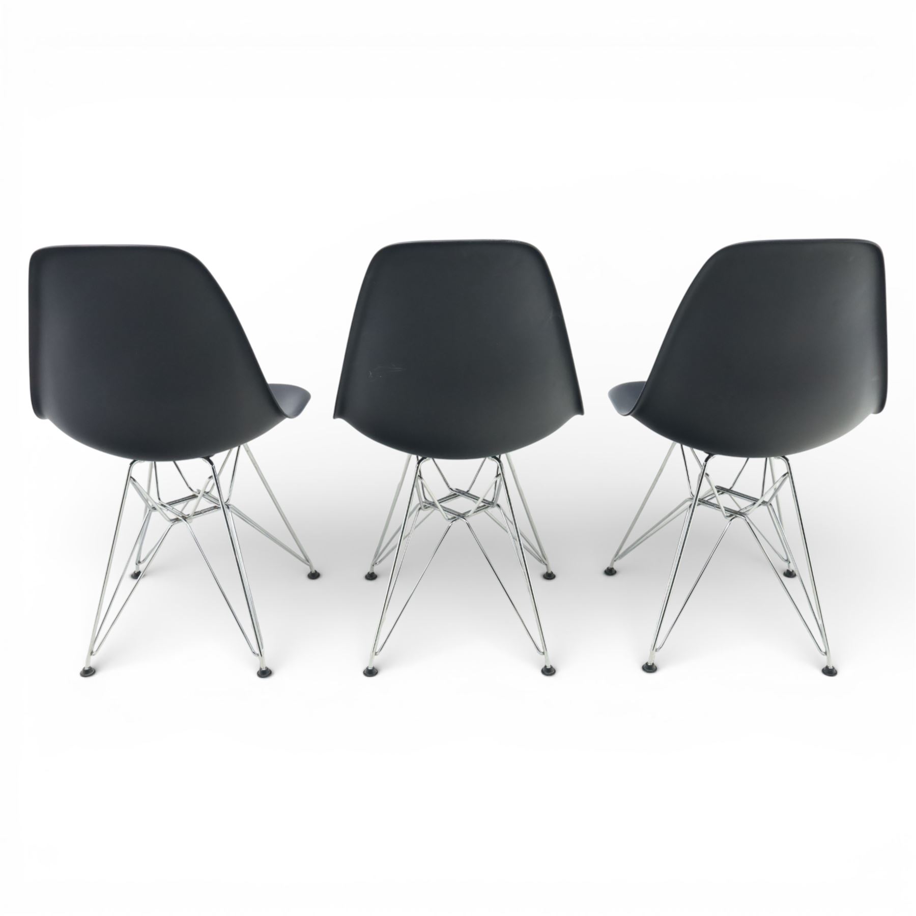 Vitra - set of six DSR side chairs designed by Charles and Ray Eames, moulded black plastic seats, raised on chromed wire Eiffel bases with plastic foot glides