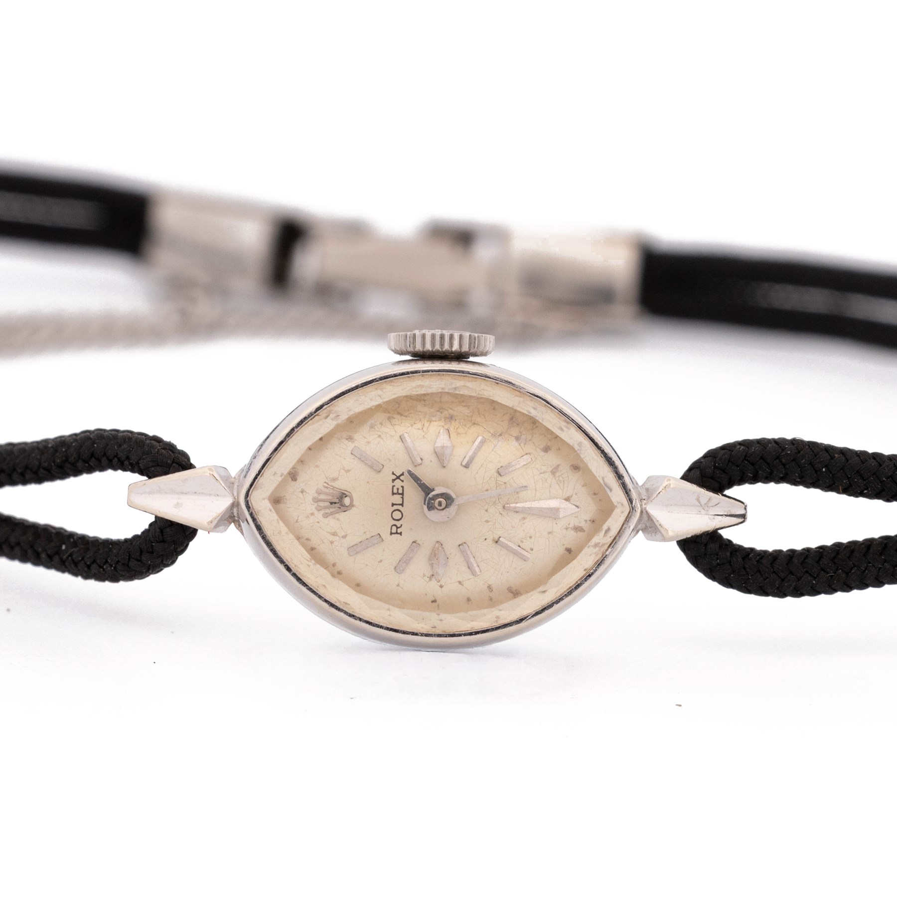 Rolex ladies 14ct white gold manual wind wristwatch, circa. 1960's, silvered dial with baton and diamond hour markers, marquise shaped case, stamped 14K, on black cord bracelet