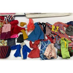 The World of Barbie Double Doll Case containing a quantity of assorted doll's clothing; together with two large and one small fashion dolls.
