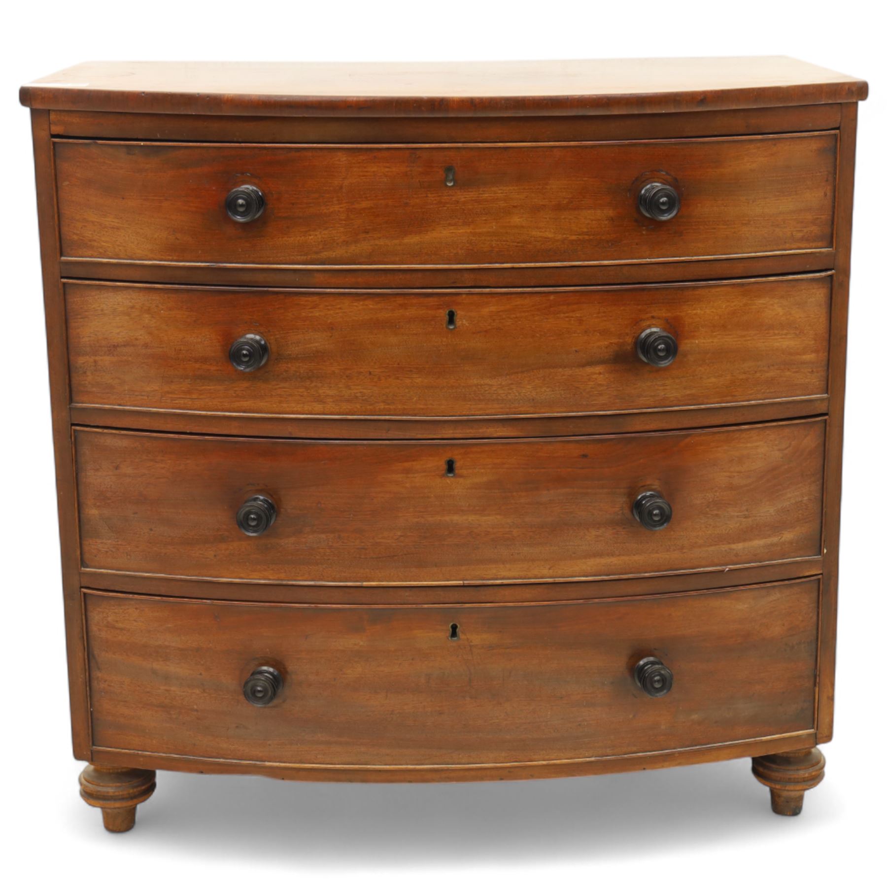 Mid-19th century mahogany bow front chest, fitted with four graduating drawers, turned ebonised handles, bun feet