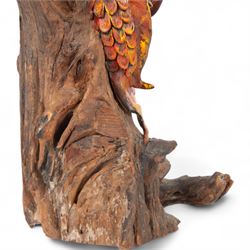 Modern Chinese root carving, modelled as a dragon wrapped round a tree, the dragon painted in greens and reds, H70cm