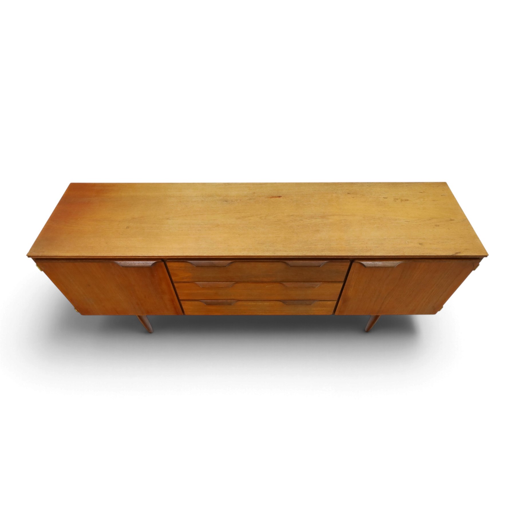 Frank Guille for Austinsuite - mid-20th century teak sideboard, fitted with three central graduating drawers flanked by cupboards, on tapering supports