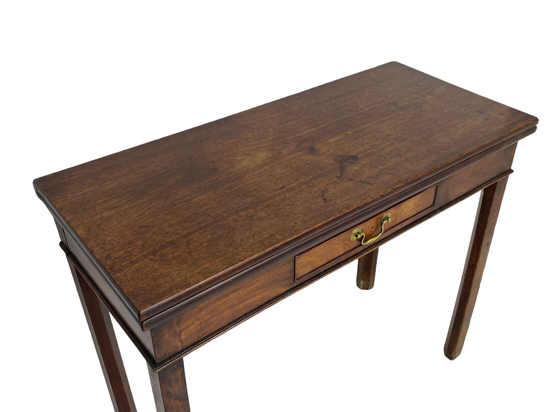 George III mahogany tea or side table, fold-over top over single gate-leg action base, fitted with single cock-beaded drawer, raised on square supports with inner chamfer