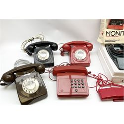 Collection of vintage telephones, including dial and button phones, together with a Monitel telephone charge clock and additional black handset. 