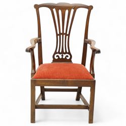George III mahogany open elbow chair, shaped cresting rail over pierced splat, shaped arms with scroll carved terminals, drop-in seat upholstered in red fabric, on square supports with moulded edge united by plain stretchers 