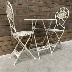 Cast metal bistro set including ornate oval garden table and two matching chairs