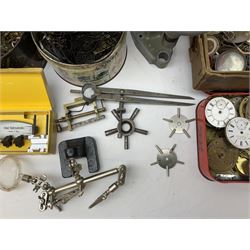 A selection of dismantled watch parts and tools, components, dials, screwdrivers, watch mainspring winder etc