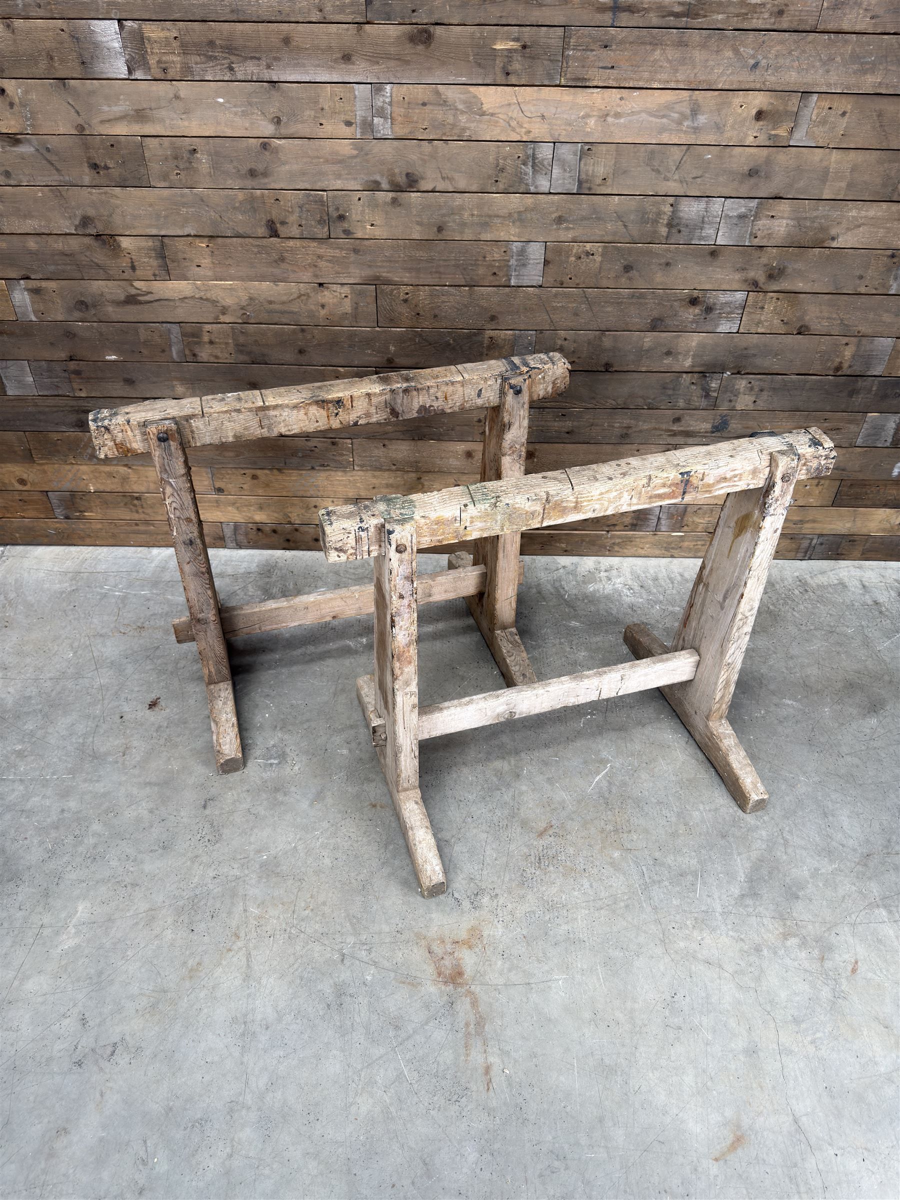 Pair of late 19th century pitch pine trestles, square tapering form in stripped finish
