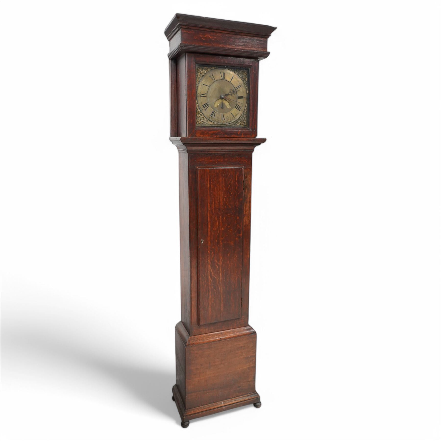 Joseph Millie of North Shields- oak cased 30hr longcase clock c1760, with a flat topped hood and deep frieze beneath, square hood door with side splats, long trunk with a conforming flat topped door with a square plinth raised on ball feet, brass dial with Rococo spandrels, matted dial centre and date aperture, chapter with Roman numerals, five minute Arabic's, minute track and matching steel hands, with a chain driven countwheel striking movement sounding the hours on a bell. With pendulum and weight.