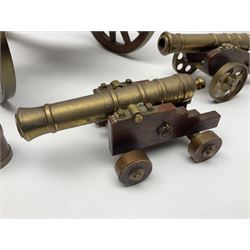 Large model brass cannon, upon wooden base, together with two similar smaller cannons, largest L48cm