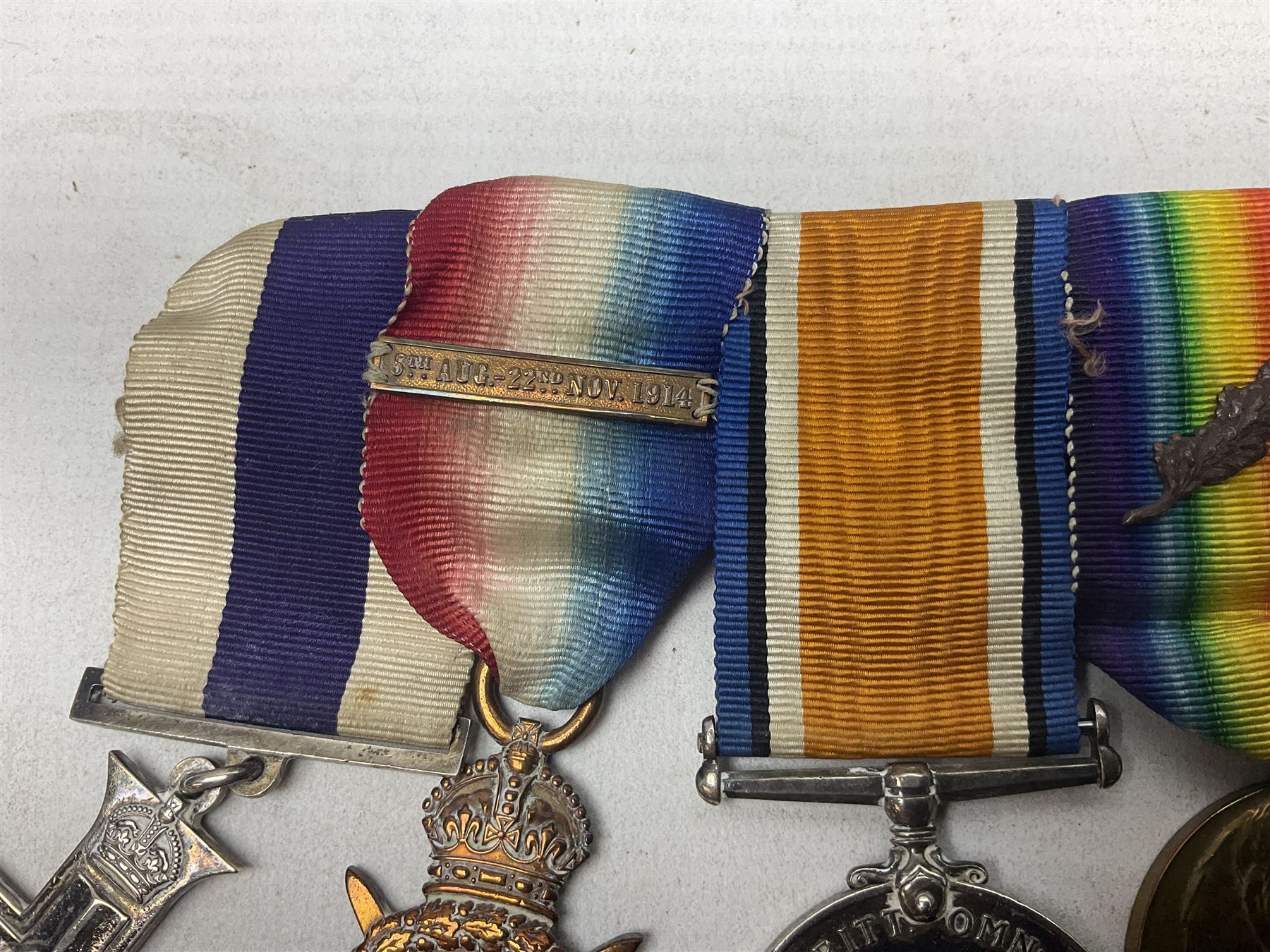 WW1/WW2 Military Cross group of five medals comprising M.C., 1914 Star with date clasp to 34156 Sjt. G. Ferguson R.F.A., British War Medal and Victory Medal with MID leaves to Major G. Ferguson, WW1 French Croix De Guerre with MID Star and WW2 Defence Medal; all with ribbons on pinned wearing bar; WW1 group of five miniature dress medals; two Royal West Kent cap badges; early 20th century silver cigarette case engraved with GF monogram and adapted as a photograph holder with image of Ferguson in civilian clothing; presentation Rotary 9ct gold cased wrist-watch with 1931 British Legion inscription verso; and archive of ephemera including 1914 MID certificate; WW2 Home Guard certificate; over twenty career spanning photographs of Regimental groups, portraits, Sandhurst etc; 1914 Commission document to 2nd Lieutenant; 11th Brigade R.F.A. Roll of Honour 1914-18; 'Soldier's Small Book'; Army Book 439 etc