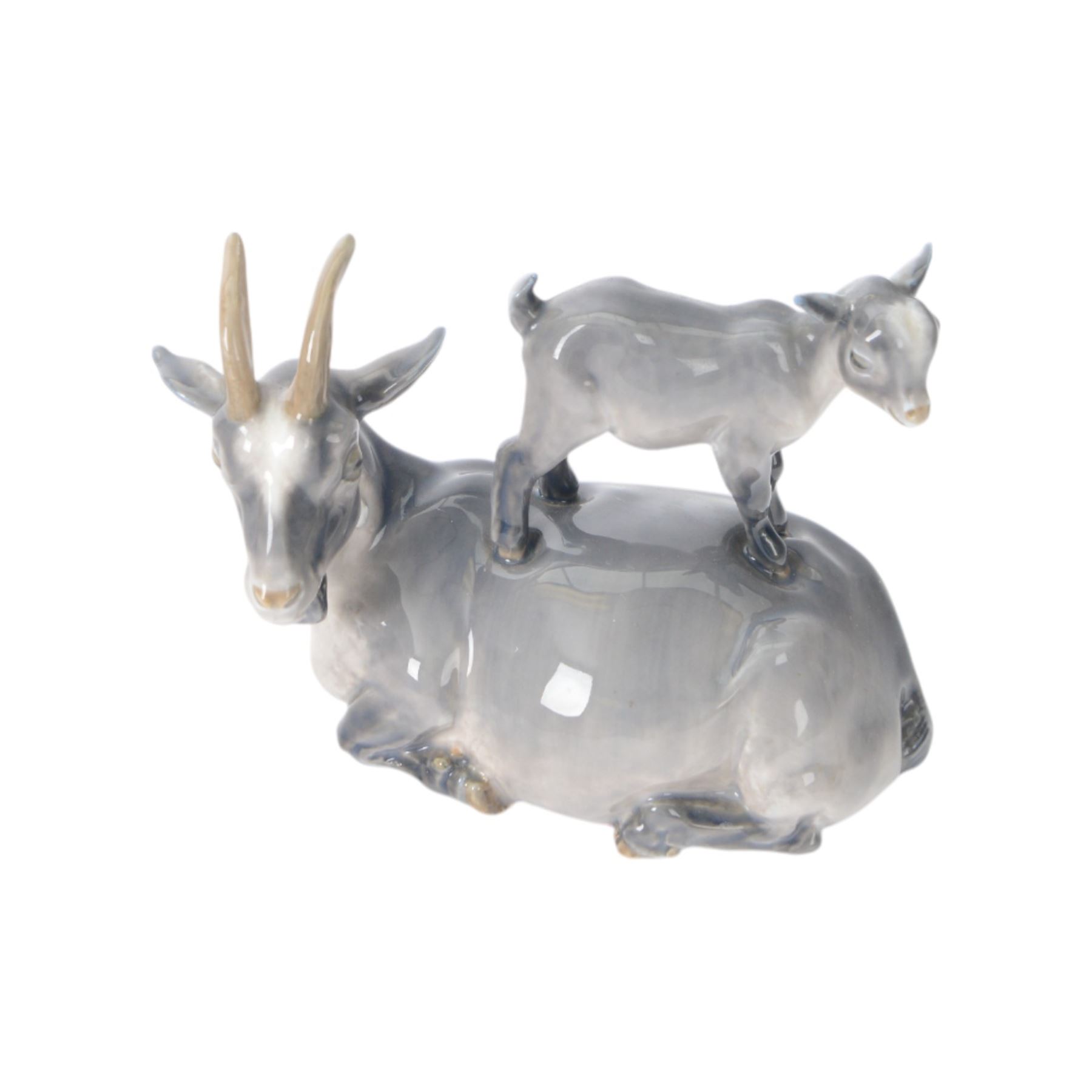 Five Royal Copenhagen figures, including Mare and Foal no.698, Goat and Kid no. 4744, Fox and Cubs no.1788