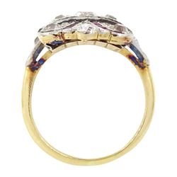 Early 20th century gold and platinum ruby and diamond panel ring, the principal old cut diamond of approx 0.30 carat, with old cut diamond surround and milgrain set calibre cut ruby ribbon motif, the tulip head shoulders set with a further diamond and ruby, total diamond weight approx 1.75 carat