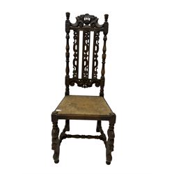 Late 19th century heavily carved oak hall chair, shaped cresting rail with boar masks, the high back with turned supports and C-scrolls with pierced slats, front supports carved with scaled dragons, united by turned stretchers