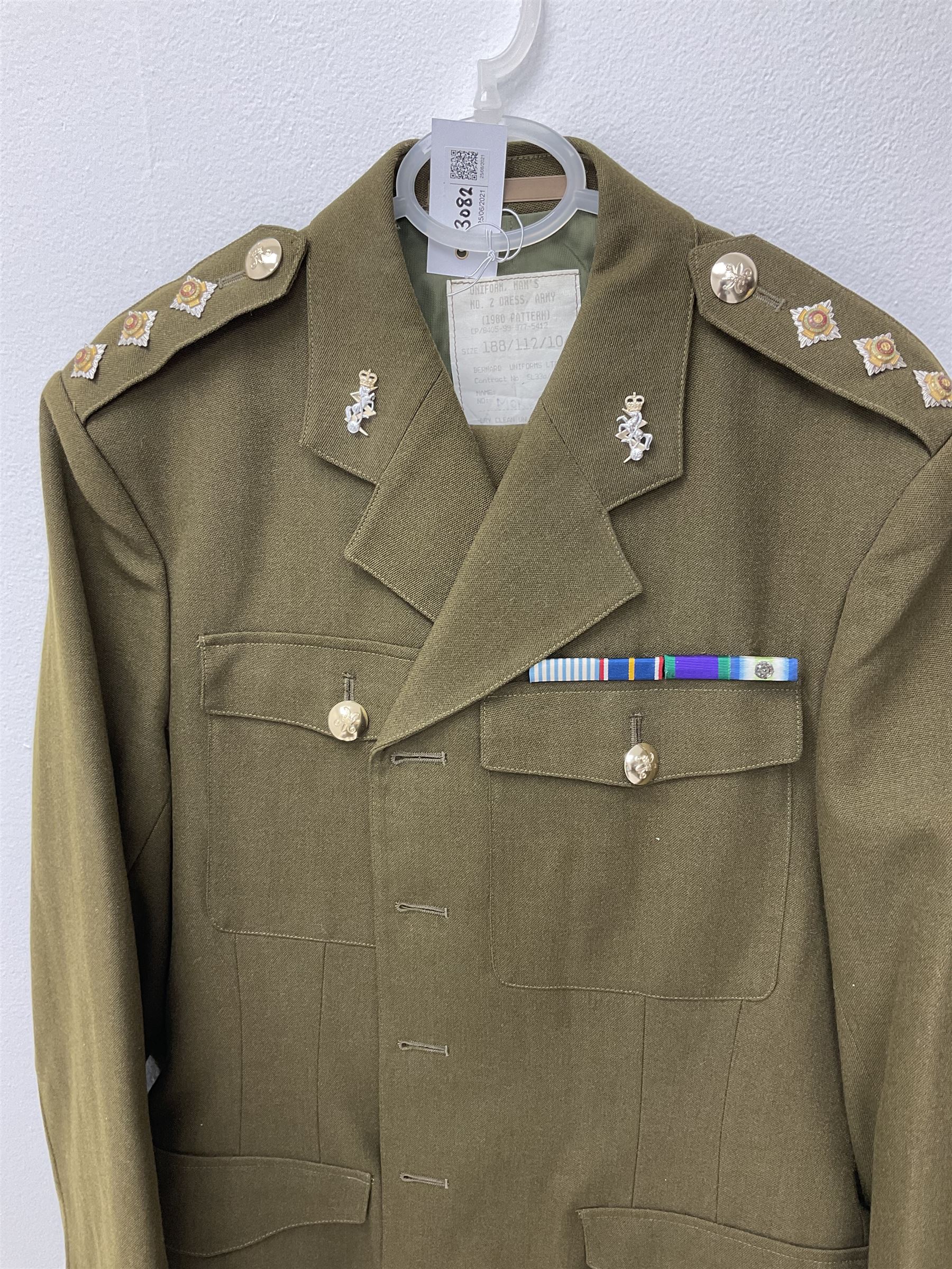 RAF Flight Lieutenant's uniform with peaked cap and WW2 ribbon bar; WW2 gas mask in blue canvas bag dated 1942; flying helmet date 1984; and British Army Major's uniform with Staybrite buttons and peaked cap