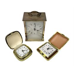 Two travelling alarm clocks with leather effect cases to include a Europa example, together with a Metamec battery operated clock