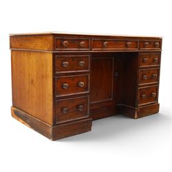 Victorian mahogany kneehole desk, rectangular top fitted with central frieze drawer over recessed cupboard, flanked by four graduating drawers to each side, on skirted base