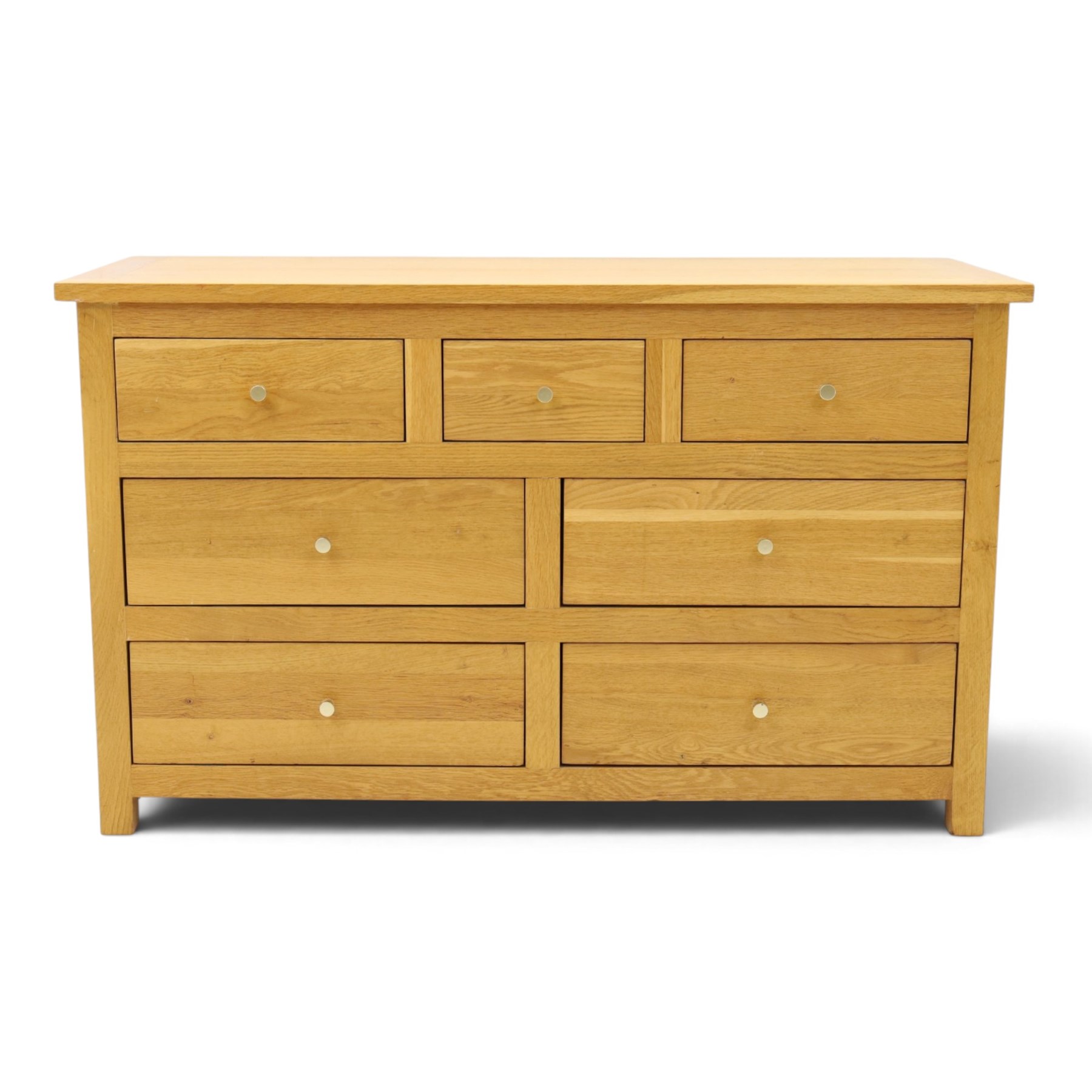 Contemporary light oak chest, rectangular top fitted with three short over four long drawers, on square feet