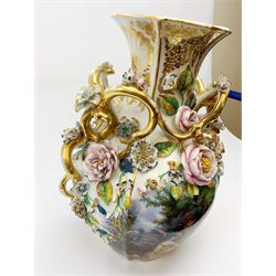A large Continental vase, of ovoid form with naturalistic modelled twin gilt handles, decorated with a hand painted figural scene and hand painted floral spray, detailed throughout with encrusted flowers and further heightened with gilt, not including associated base H45.5cm. 