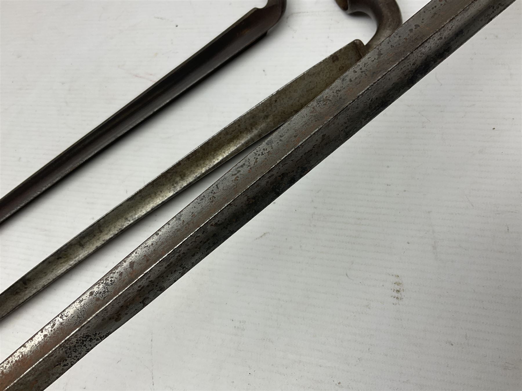 Early 19th century British Brown Bess musket rifle socket bayonet with zigzag fitting stamped D71 and triangular blade stamped 270 L55cm overall; and two other 19th century socket bayonets; no scabbards (3)