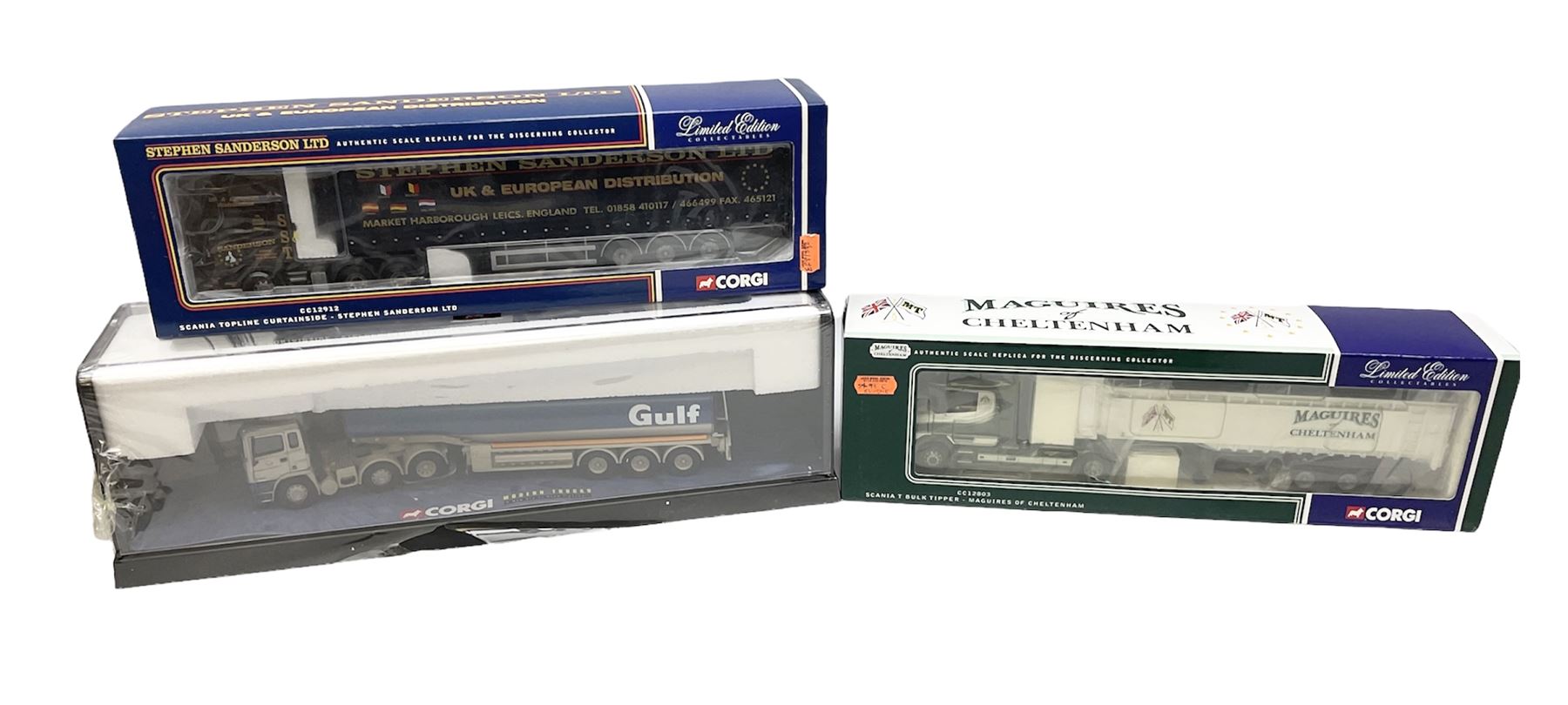 Three Corgi 1:50 scale lorries - ERF Tanker - Gulf Oil in perspex display case No.75101; limited edition Scania T Bulk Tipper - Maguires of Cheltenham No.CC12803; and Scania Topline Curtainside - Stephen Sanderson Limited No.CC12912; all boxed (3)