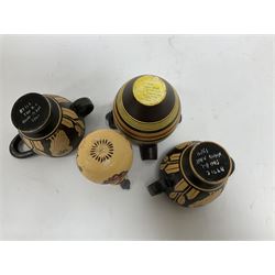 Four examples of reproduction Ancient Greek pottery, to include two skyphoi decorated with the Owl of Athena, standing between two sprays of olive in the manner of 5th century, both signed Attic 500 B.C,  terracotta twin handled vase with spout decorated in the Corinthian Geometric style, in the manner of 6th Century, signed beneath, and a further jug in the 7th Century Corinthian style decorated with flowers and birds