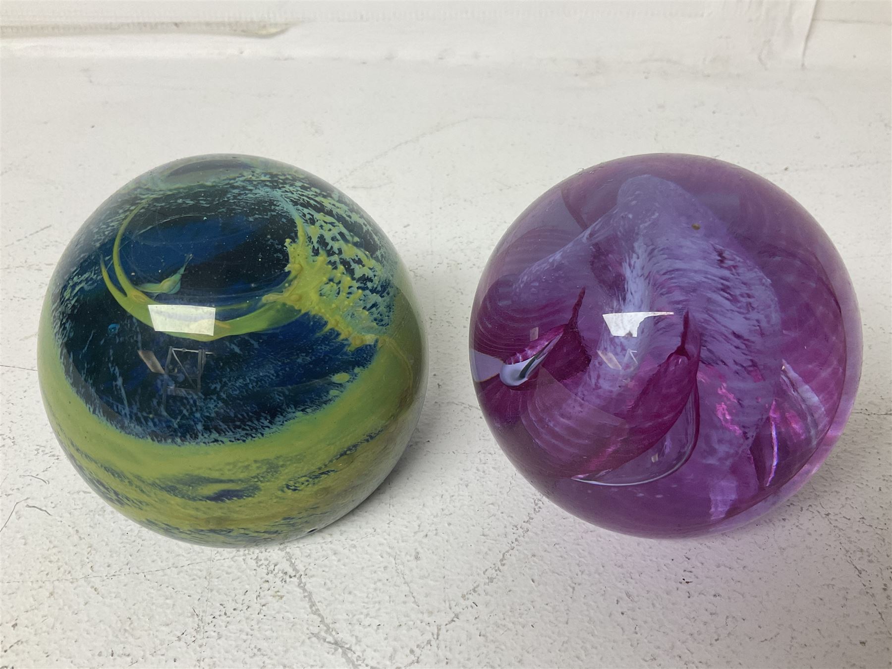 Twelve Caithness glass paperweights, to include Pastel, Mooncrystal and Fiesta, together with Baccarat 'The Princess Anne' paperweight and two Mdina examples (15)