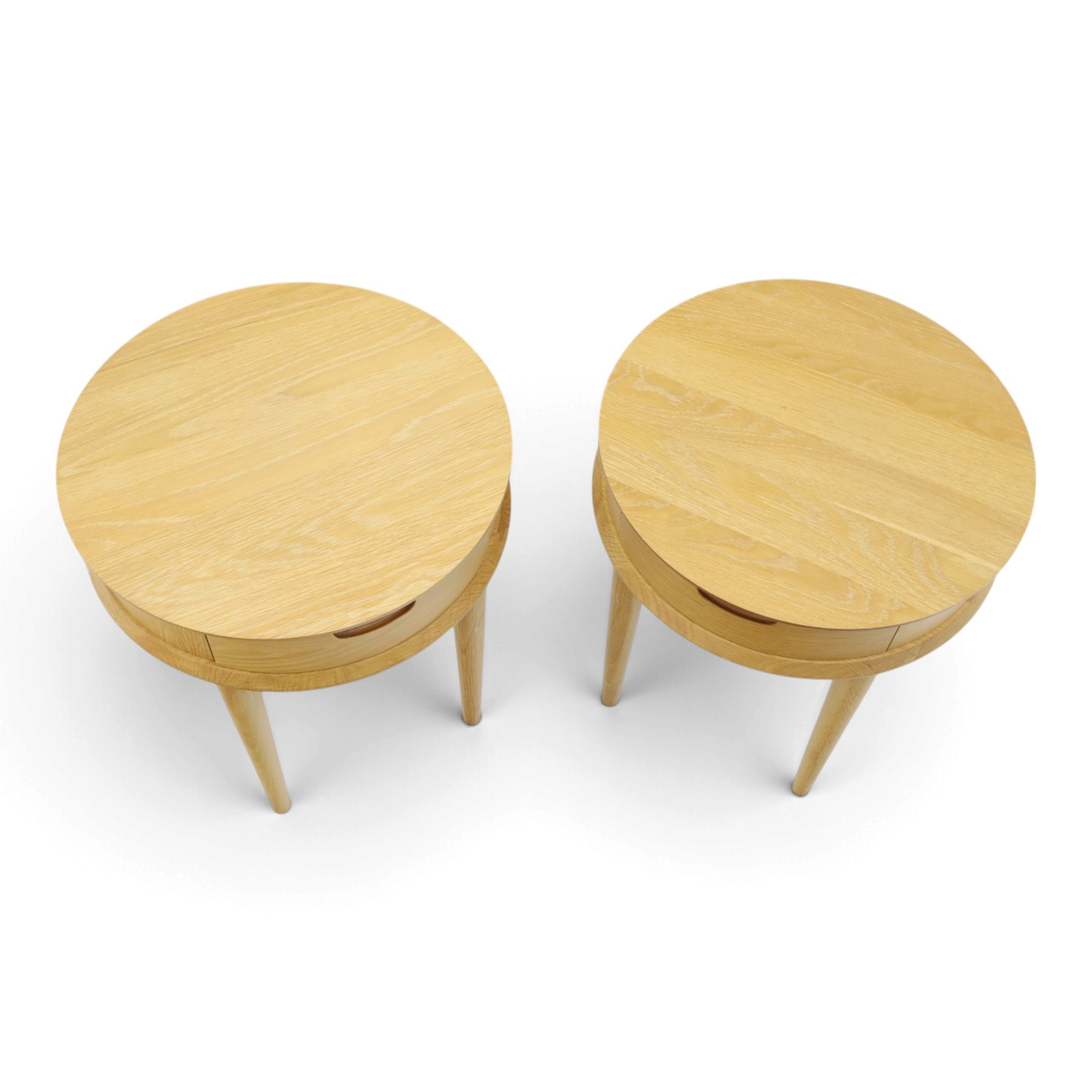 Bentley Designs - Pair of 'Dansk' light oak circular bedside or lamp tables, one drawer with recessed handle, tapering circular supports