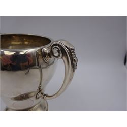 1920s silver trophy cup, of typical form, with twin C scroll handles, upon stepped circular base, hallmarked Birmingham 1926, maker's mark worn and indistinct, H14cm