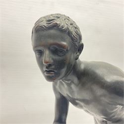 Bronzed figure of a nude male, upon a stepped marble base, H45cm