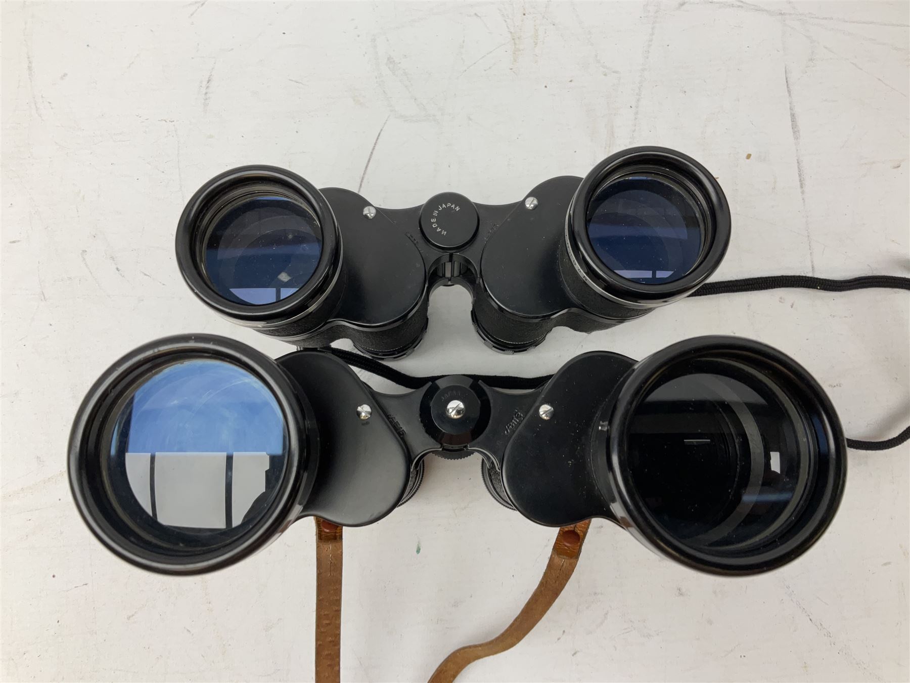 Nine cased pairs of binoculars, to include Tohyoh 22x70, Greenkat 7x- 12x50, Chinon, Fisher-Dietz 7x50, etc