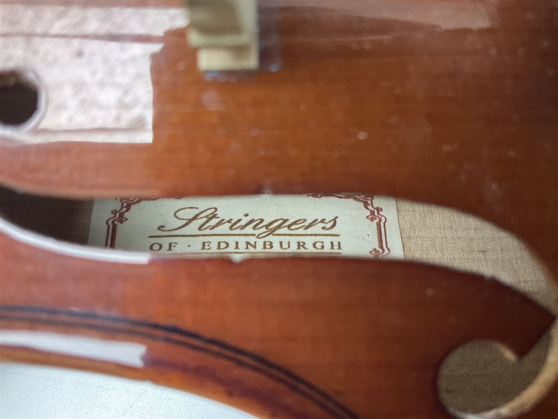 Four student violins - two Chinese three-quarter size with 33.5cm and 34cm two-piece backs; Stringers of Edinburgh quarter size with 28cm two-piece back; and Stentor quarter size with 28cm two-piece back; each in carrying case (4)