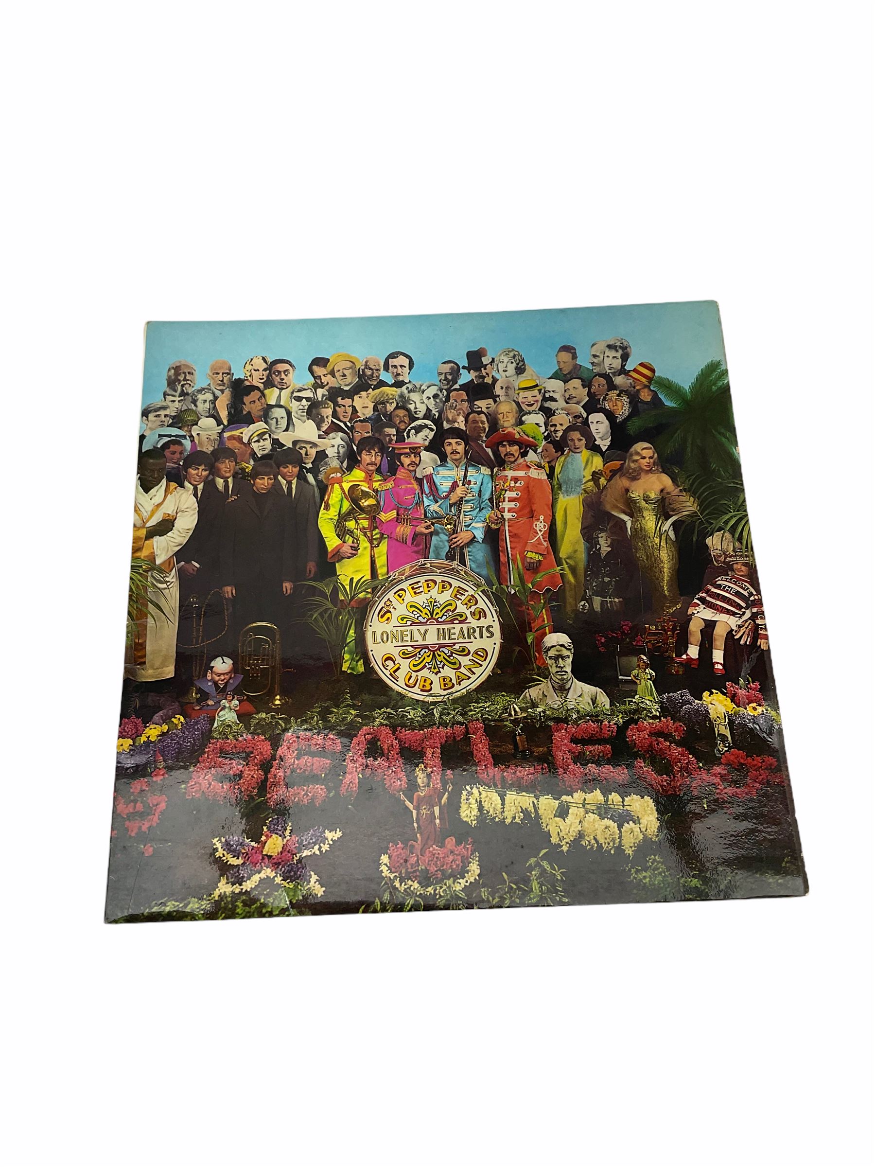 Mid 20th century Turkish film poster, 'Sevimli Mahkum' (After the Fox), H100cm L70cm, together with three other later posters, including one detailed 'Hair The America Tribal Love-Rock Musical', and a Beatles St Peppers Lonely Hearts Club Band vinyl record sleeve. 