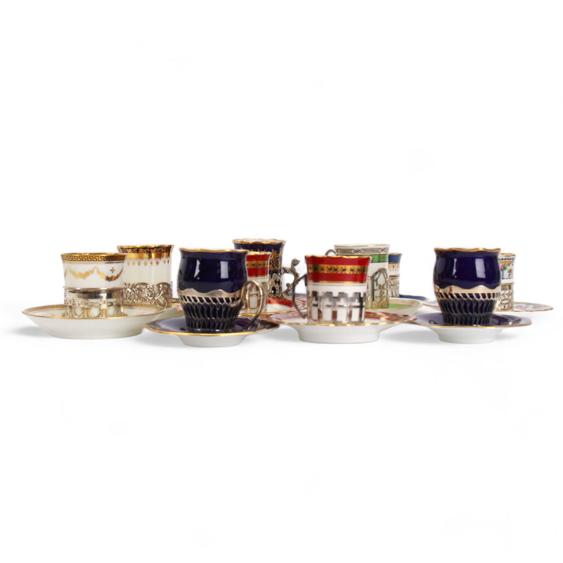 Collection of coffee cans, with silver holders, including two Aynsley examples with maroon and gilt decoration, two Coalport examples in cobalt blue etc all hallmarked 