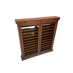 Modern hardwood display cabinet for model railway locomotives inscribed 'Gresley Pacifics' to the frieze and 'LNER' to the bottom rail; with mirrored back and ten loose fitting shelves enclosed by a pair of unglazed doors L101cm H108cm D16cm