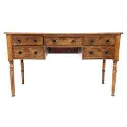 William IV mahogany writing table, five drawers, turned tapering reeded supports 