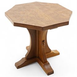 Mouseman - oak coffee table, octagonal adzed top on cruciform base and sledge feet, carved with mouse signature, by the workshop of Robert Thompson, Kilburn