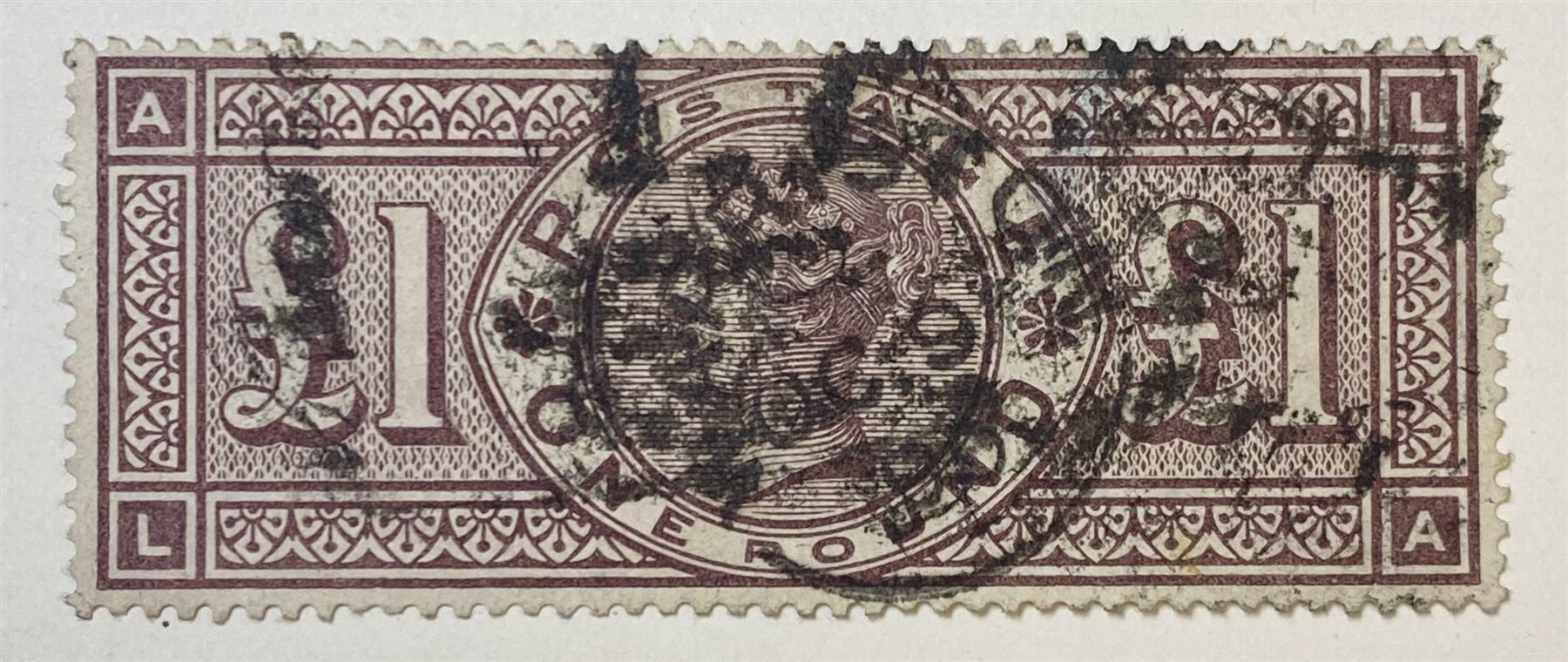 Great Britain Queen Victoria 1884 one pound brown-lilac stamp, used, previously mounted