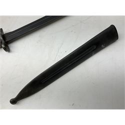Swiss Model 1957 SIG rifle bayonet by Wenger with 23.5cm steel blade numbered 350857; in plastic scabbard with leather frog stamped GSCH 85 L38cm overall; and Egyptian Hakim rifle bayonet with the same script number to the grip and steel scabbard (2)
