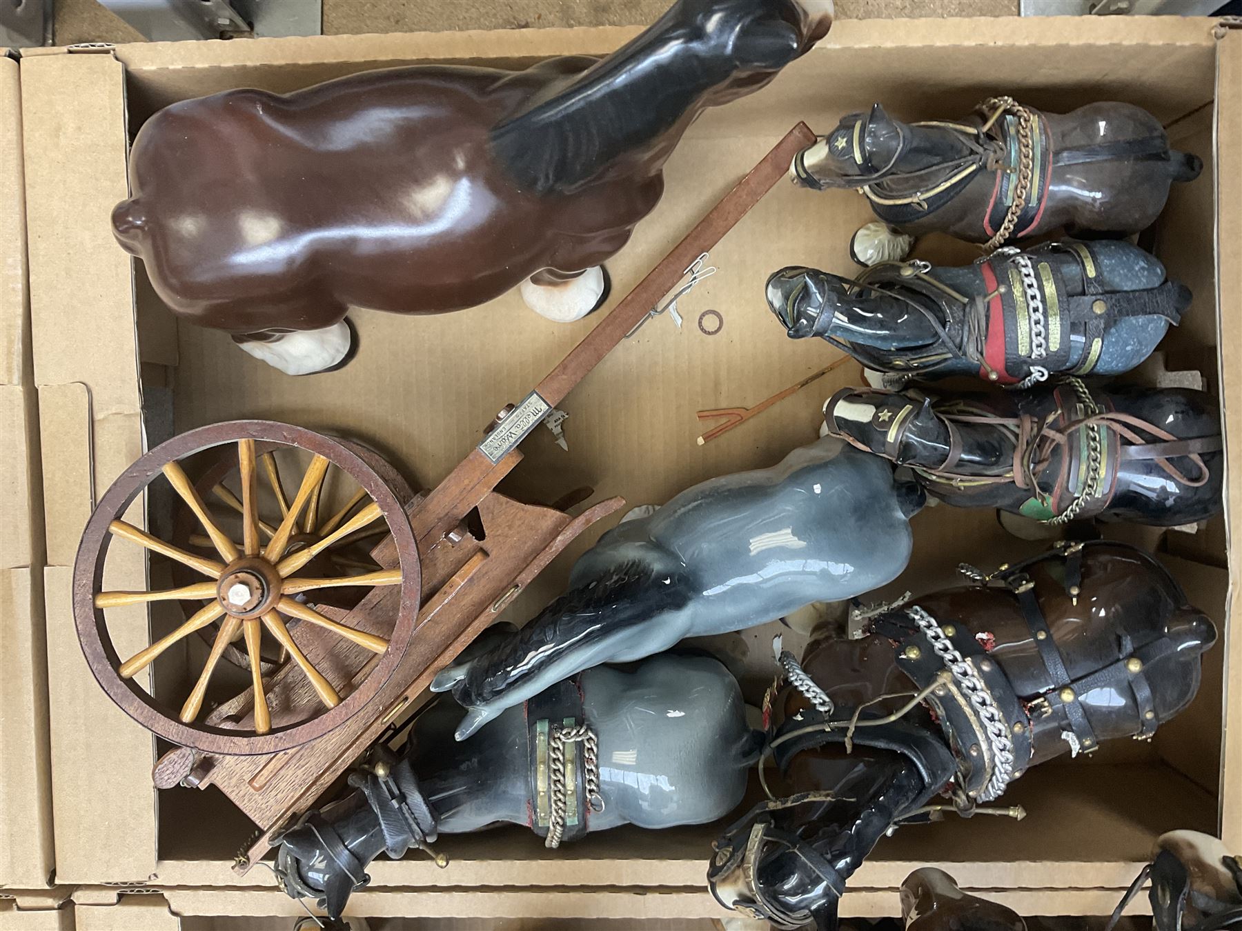 Approximately forty seven ceramic Shire horses to include Sylvac and Melba Ware examples of various sizes and colours, many with harnesses, and a quantity of carts and wagons 