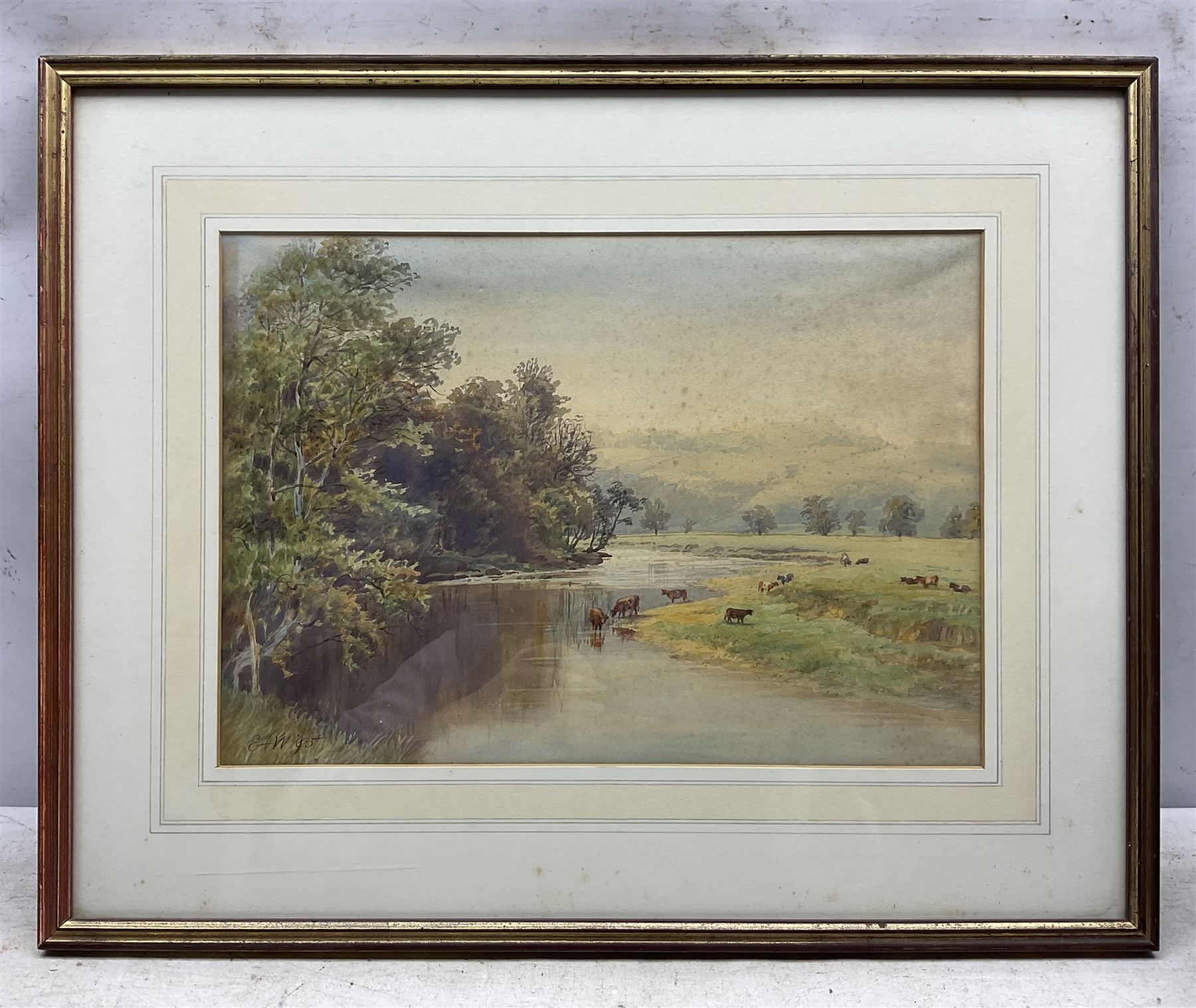 Sir Ernest Albert Waterlow (British 1850-1919): 'A River Landscape with Cattle on the Banks', watercolour signed with initals and dated '95, titled on label verso 26cm x 38cm 
