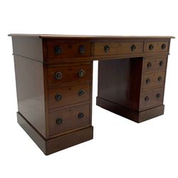Howard & Sons. - 19th century walnut twin pedestal desk, moulded rectangular top with tooled leather inset, fitted with nine drawers with circular pressed brass handle plates decorated with urns, each drawer fitted with a 'Hobbs, London' lock, on plinth base, the upper right-hand drawer stamped 'Howard & Sons, Berners St.' and with paper label