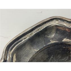 Silver plated tray, with shaped rim and embossed with a dog and crown to centre, stamped Valenti, together with three silver plated decanter labels, two port and one Bucellas, a plated cream jug with embossed floral decoration and a pair of plated fish knives engraved with double headed eagle to handle, tray W25.5